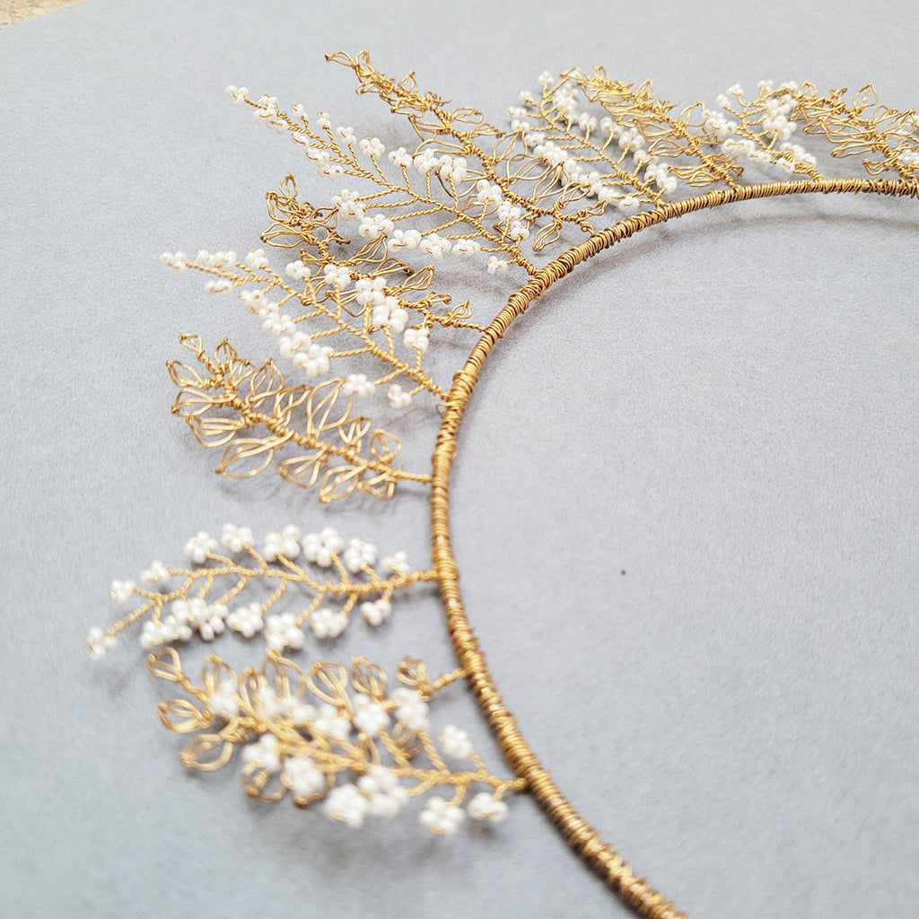 Close up of gold wire and white beads bridal crown by judith brown bridal