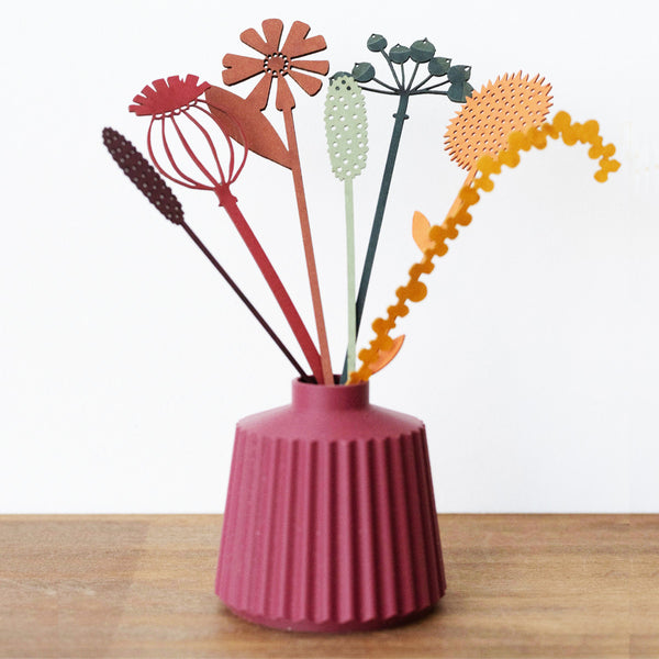 A joyful posy of spring flowers from artist Hannah Nunn's collection of all-year-round bouquets of meadow flowers and grasses and joyful sunflowers to hang in your window. Laser cut from colourful card in her Hebden Bridge studio.  Shown in a vase (not included)