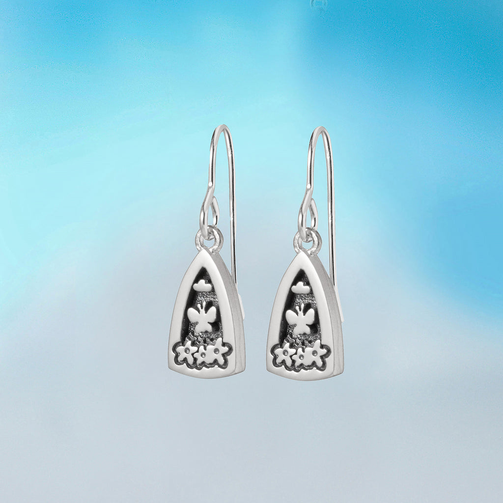 silver earrings by contemporary irish jeweller Alan Ardiff which feature elements of nature including butterflies, clouds and flowers to capture the beautiful moments that happen in the garden