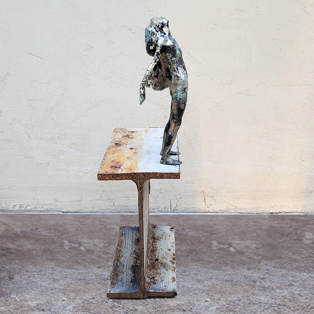 Side view of Johnny Vegas Sculpture - Motion captured 3D printed figure mounted on a salvaged RSJ steel girder featuring gold and silver leaf