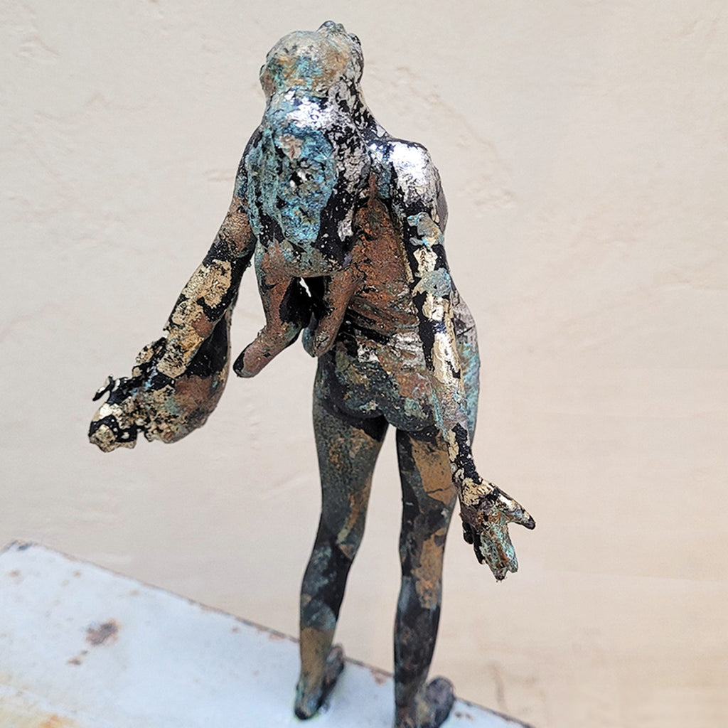 Close up of Johnny Vegas Sculpture - Motion captured 3D printed figure mounted on a salvaged RSJ steel girder featuring gold and silver leaf