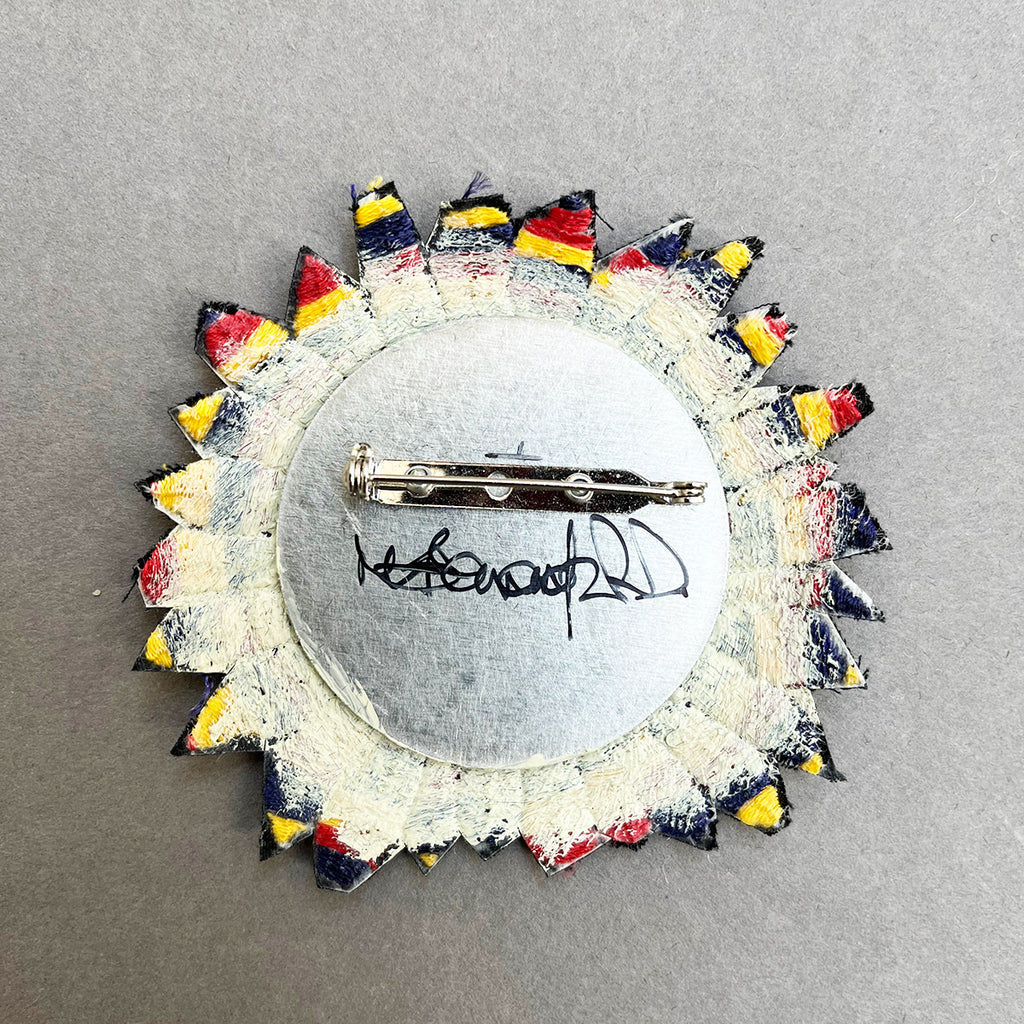 Reverse of beautiful machine embroidered brooch by Michael Brennand -Wood, sold with a hand-painted presentation box.  The brooch is red, blue and yellow