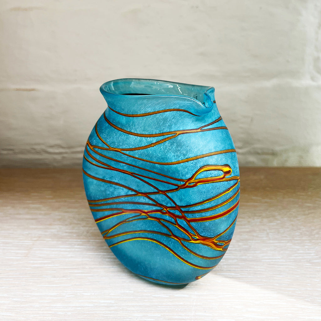 small aqua clutch jug from Will Shakspeare's 'Random Trails' range, inspired by walking in the Elan Valley in Wales.   Will has been making his own inimitable glassware for nearly 30 years and is one of the country's most collected makers
