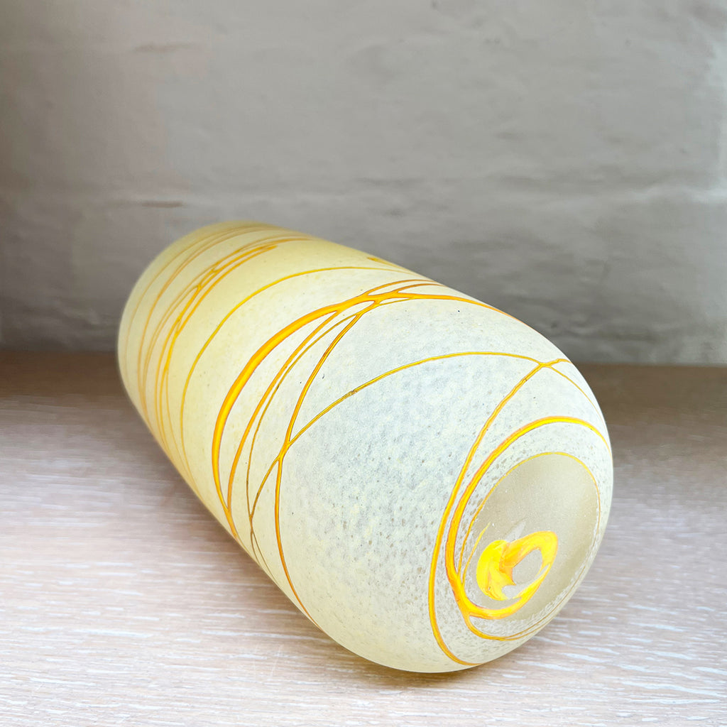 Base of a vanilla coloured vase from Will Shakspeare's 'Random Trails' range, inspired by walking in the Elan Valley in Wales.  Will has been making his own inimitable glassware for nearly 30 years and is one of the country's most collected makers
