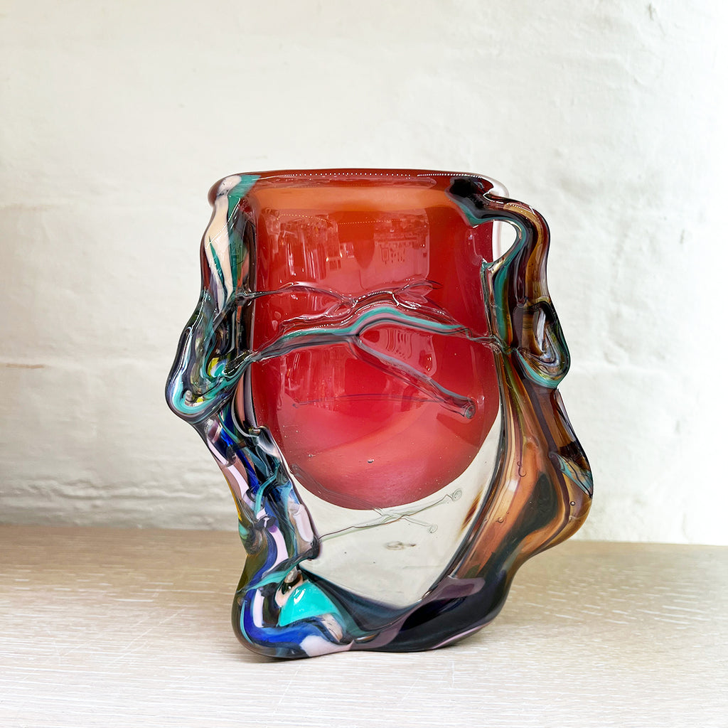 stunning bowl by contemporary glass artist Will Shakspeare. The piece is inspired by trees and is predominantly red in colour with 'roots' in blues and a kaleidoscope of colours. at the Bluecoat Display Centre Liverpool