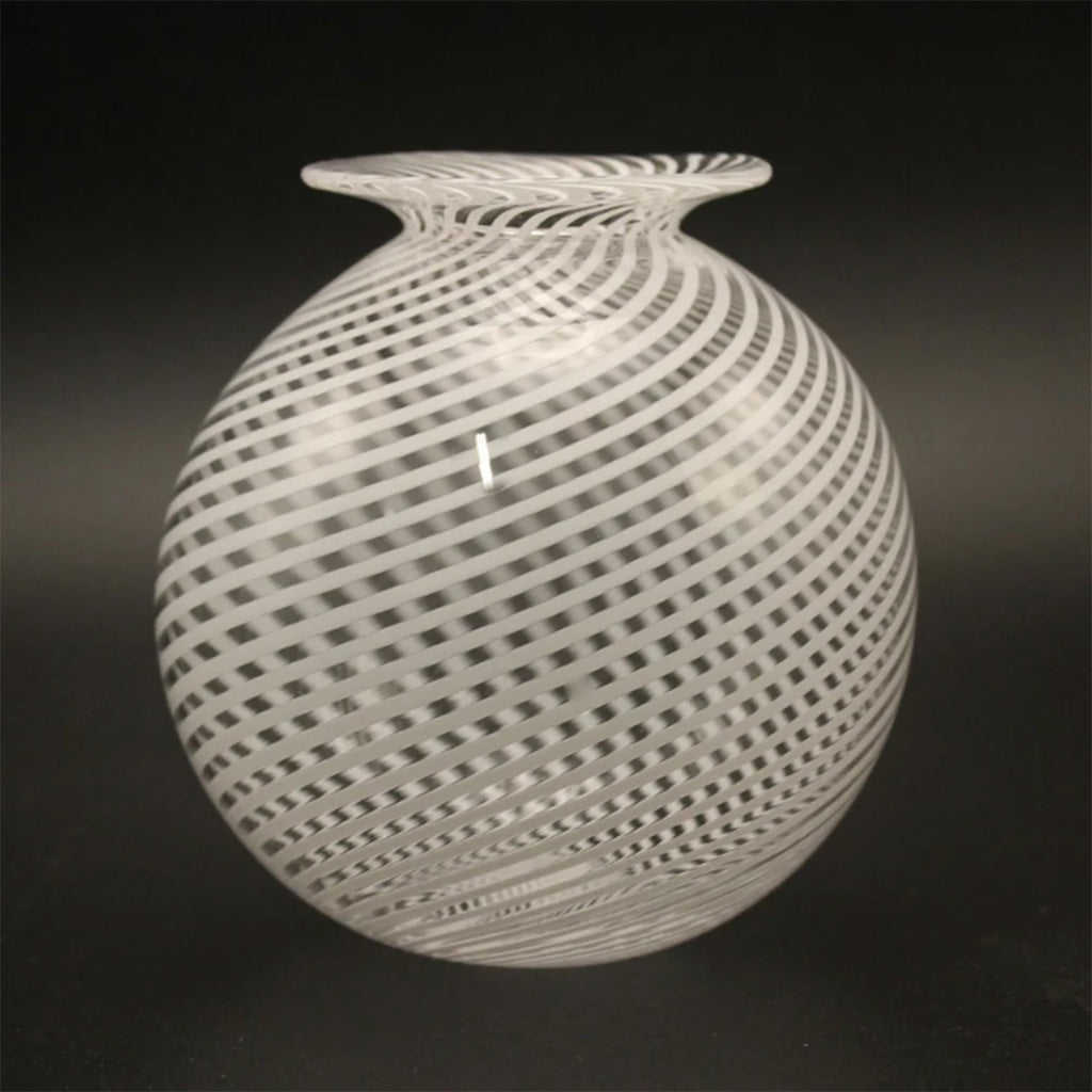 large round glass vase with the distinctive filigrana style of blown glass with an alternating pattern of clear and white canes, which originated on the island of Murano in the 16th Century.