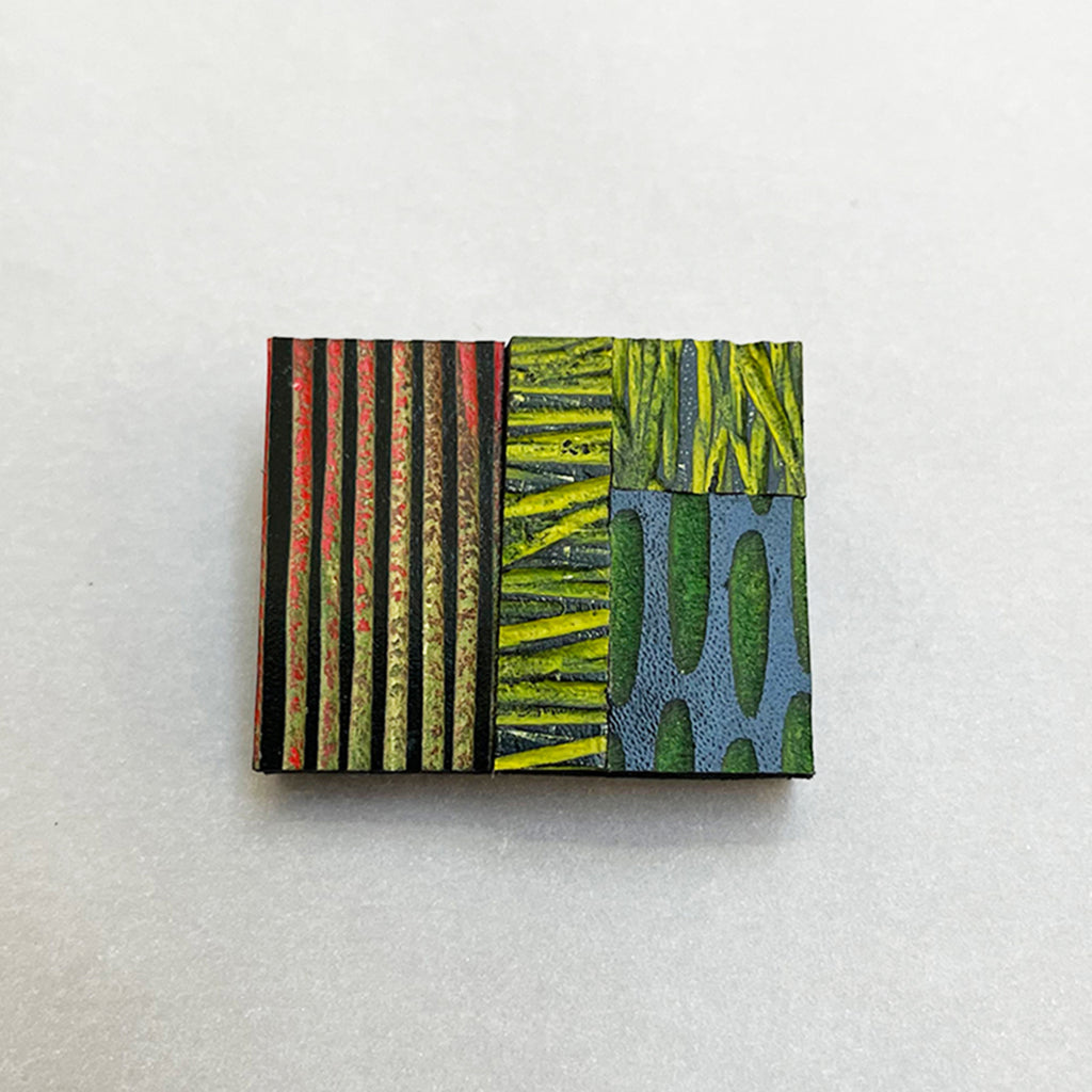 multi-coloured hand painted leather brooch by Janine Partington