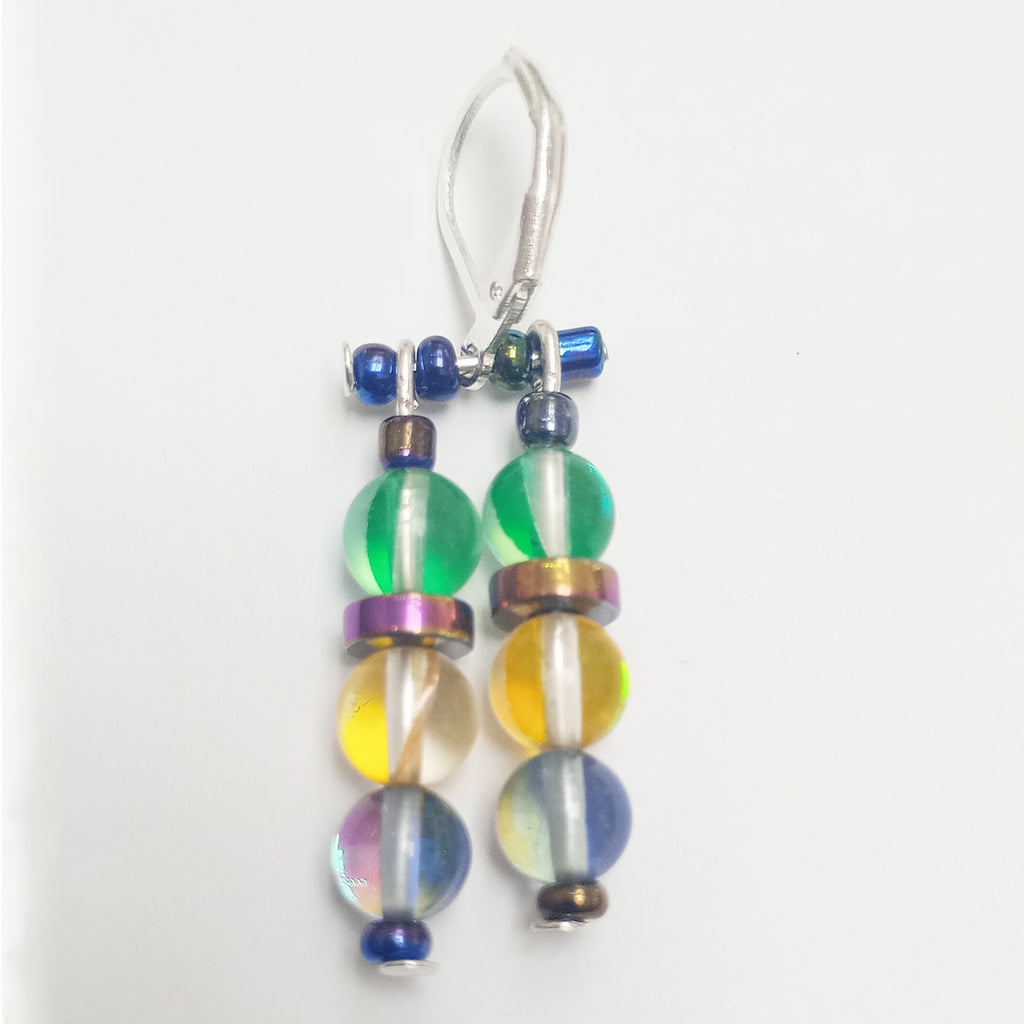 close up of beautiful dyed quartz triple bead earrings with two strands and feature various glass beads in green, gold and blue on Sterling silver fittings