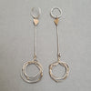 sterling silver drop earrings with gold hearts and gold accents on the textured silver drops