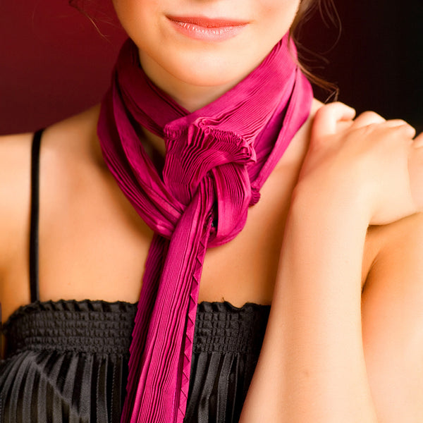 Woman wearing Amro Pleat Pink Scarf by Nawal Gebreel with a black top 