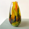side view of vibrant multicolored glass vase hand blown by Jane Charles