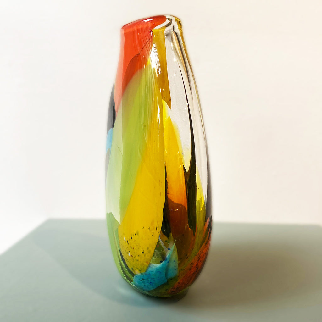 side view of vibrant multicolored glass vase hand blown by Jane Charles