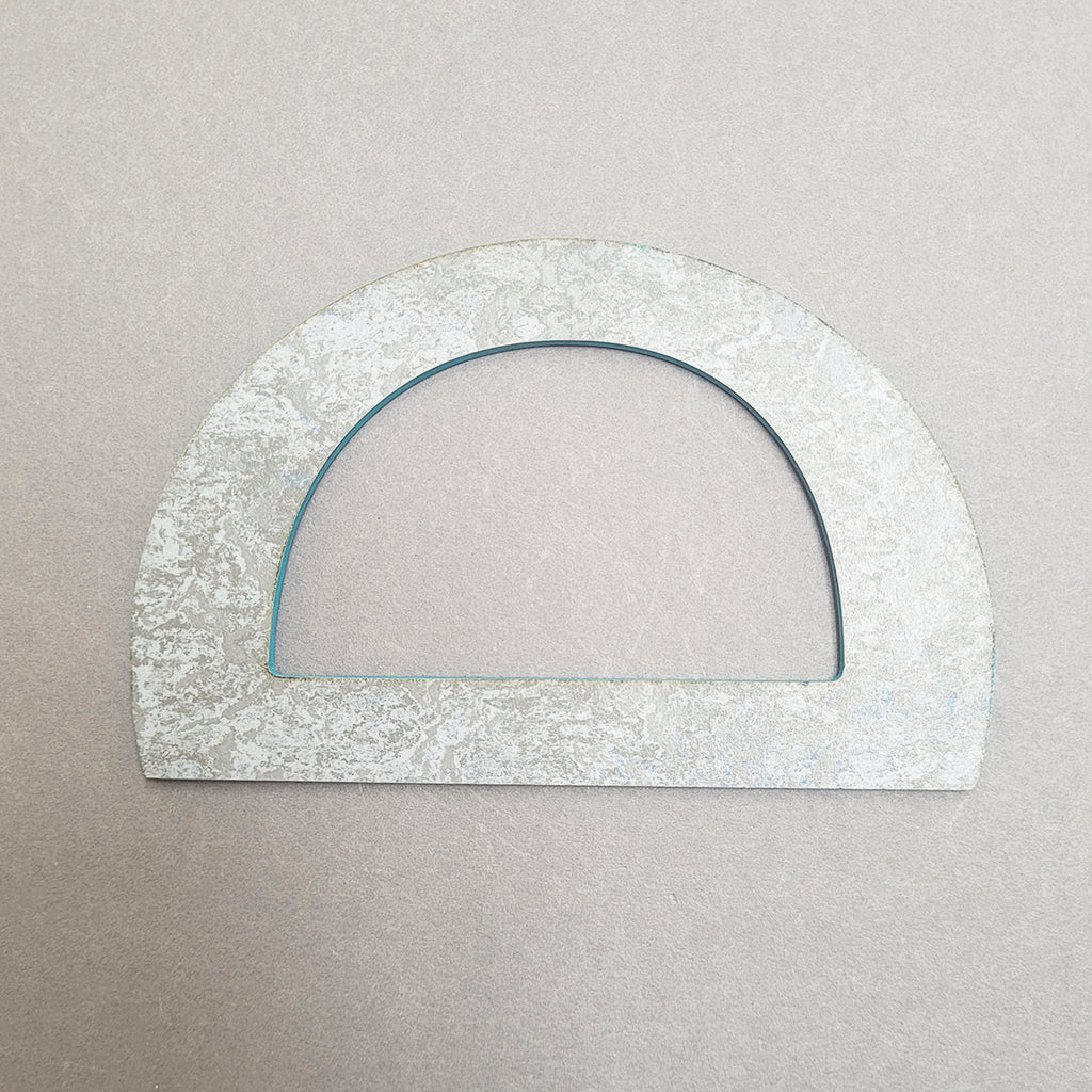 rear side of Teal D-shaped bangle inspired by the Bauhaus design movement. Made from linoleum and hand painted by Studio Ditto