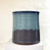 Rear of beautiful hand thrown blue gradient medium vase, with a single swallow at the center point by Julia Smith Ceramics