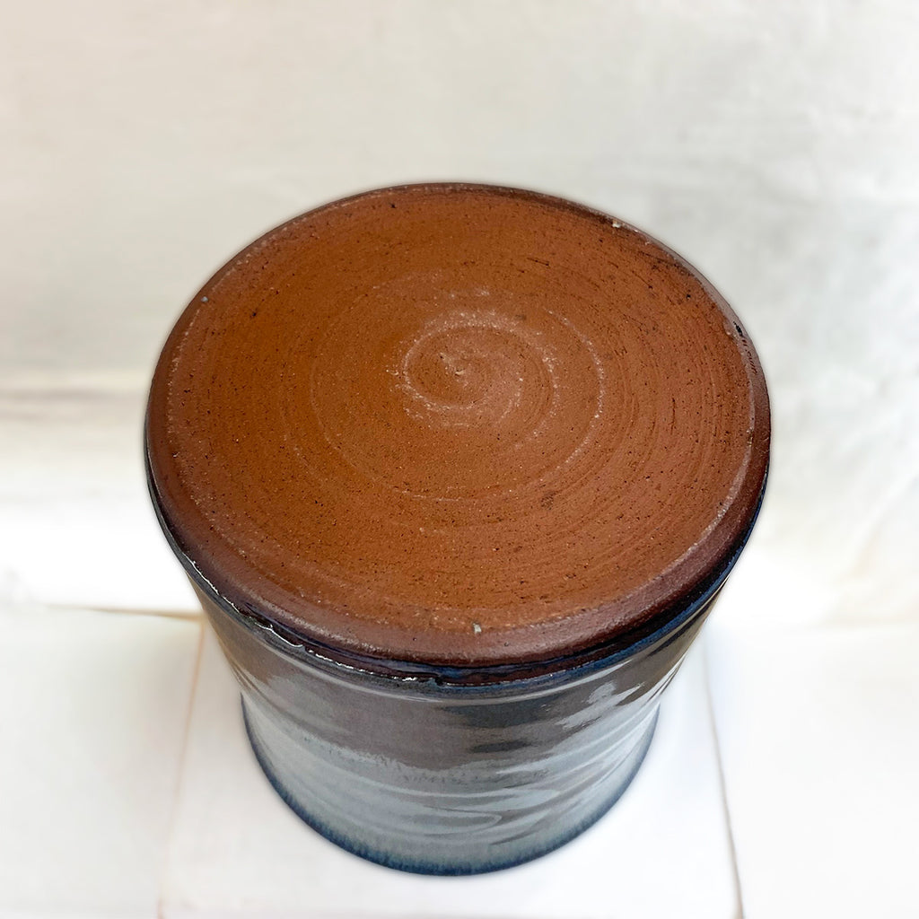 Base of beautiful hand thrown blue gradient medium vase, with a single swallow at the center point by Julia Smith Ceramics