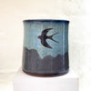 beautiful hand thrown blue gradient medium vase, with a single swallow at the center point by Julia Smith Ceramics