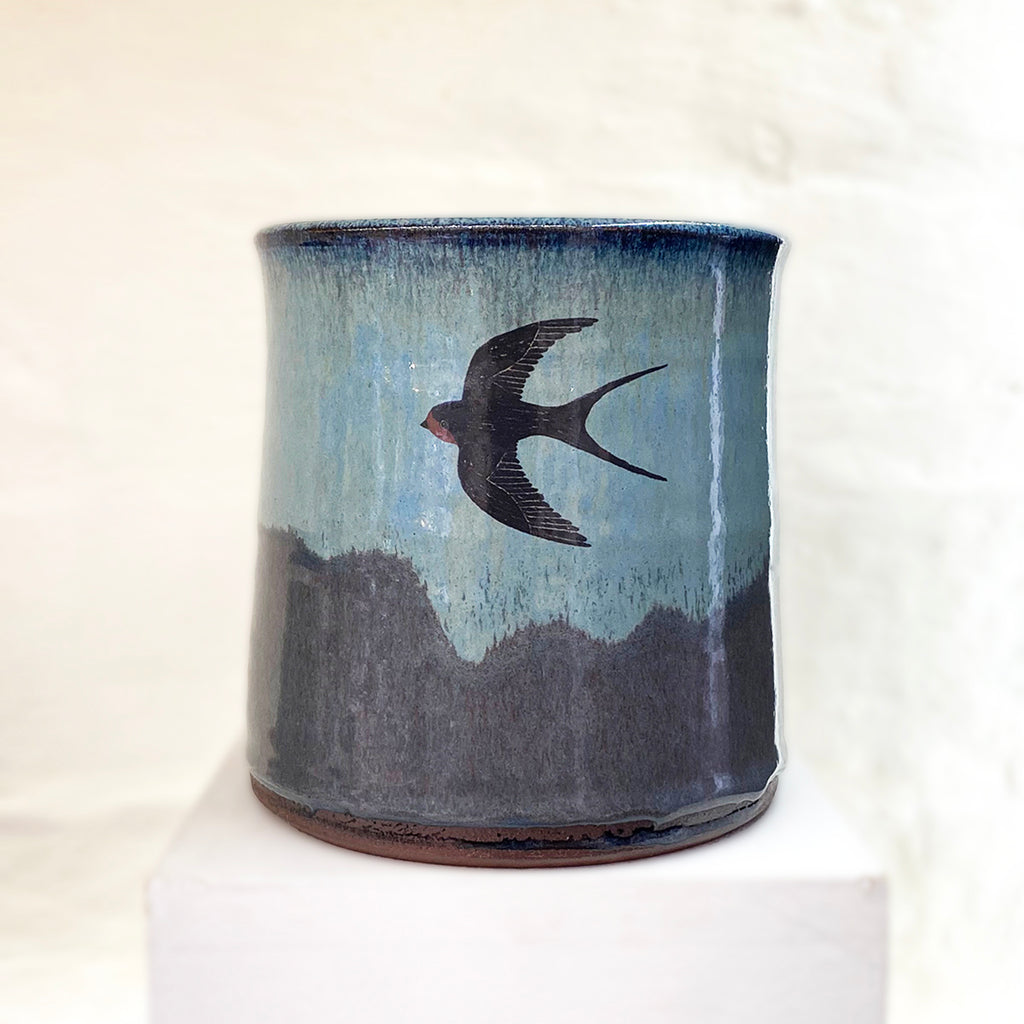 beautiful hand thrown blue gradient medium vase, with a single swallow at the center point by Julia Smith Ceramics