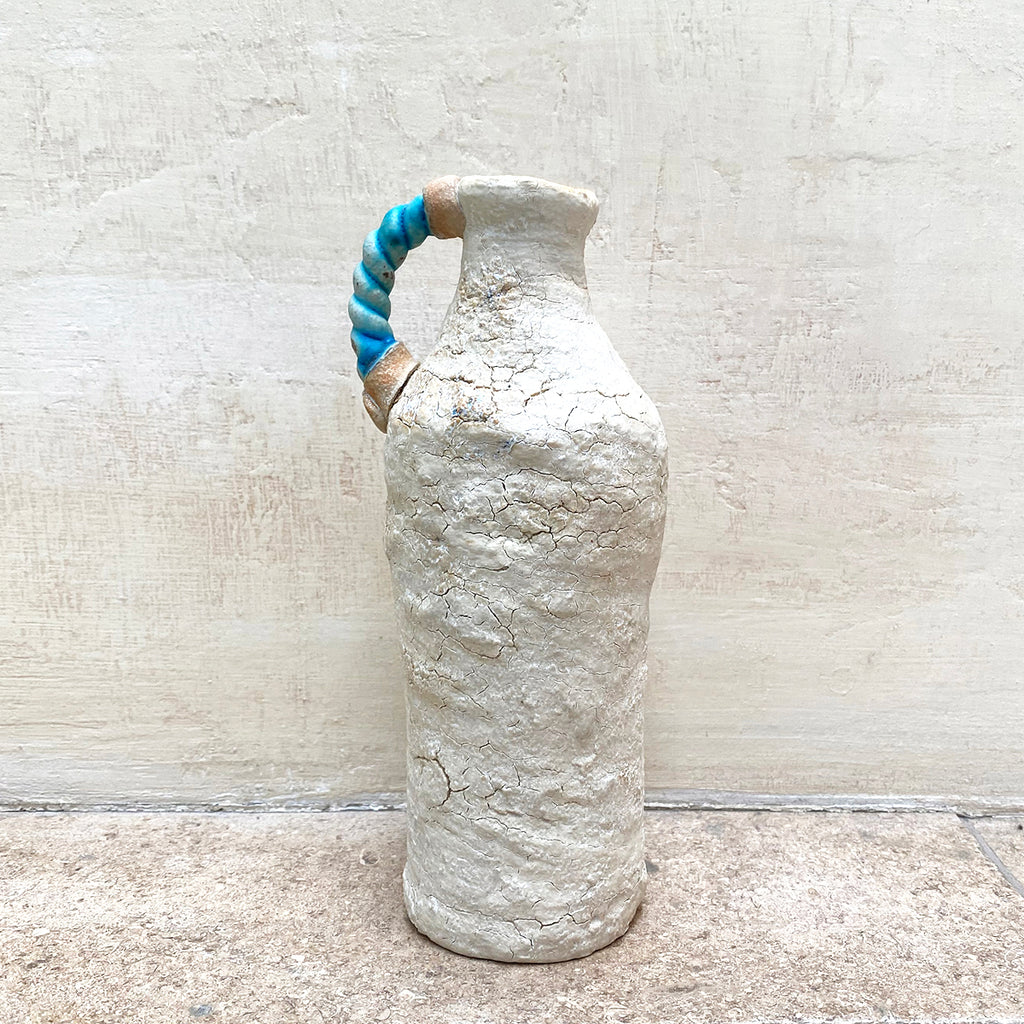 A ballclay rough textured bottle vase with a blue stoneware twisted handle by contemporary ceramicist John Kershaw