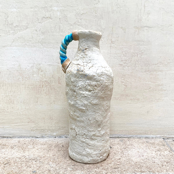 A ballclay rough textured bottle vase with a blue stoneware twisted handle by contemporary ceramicist John Kershaw