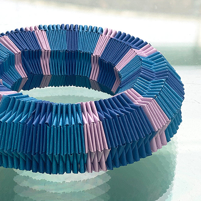 Detail of bold chunky blue and purple paper bracelet by Rike Lenzing in blue, lilac and purple paper 