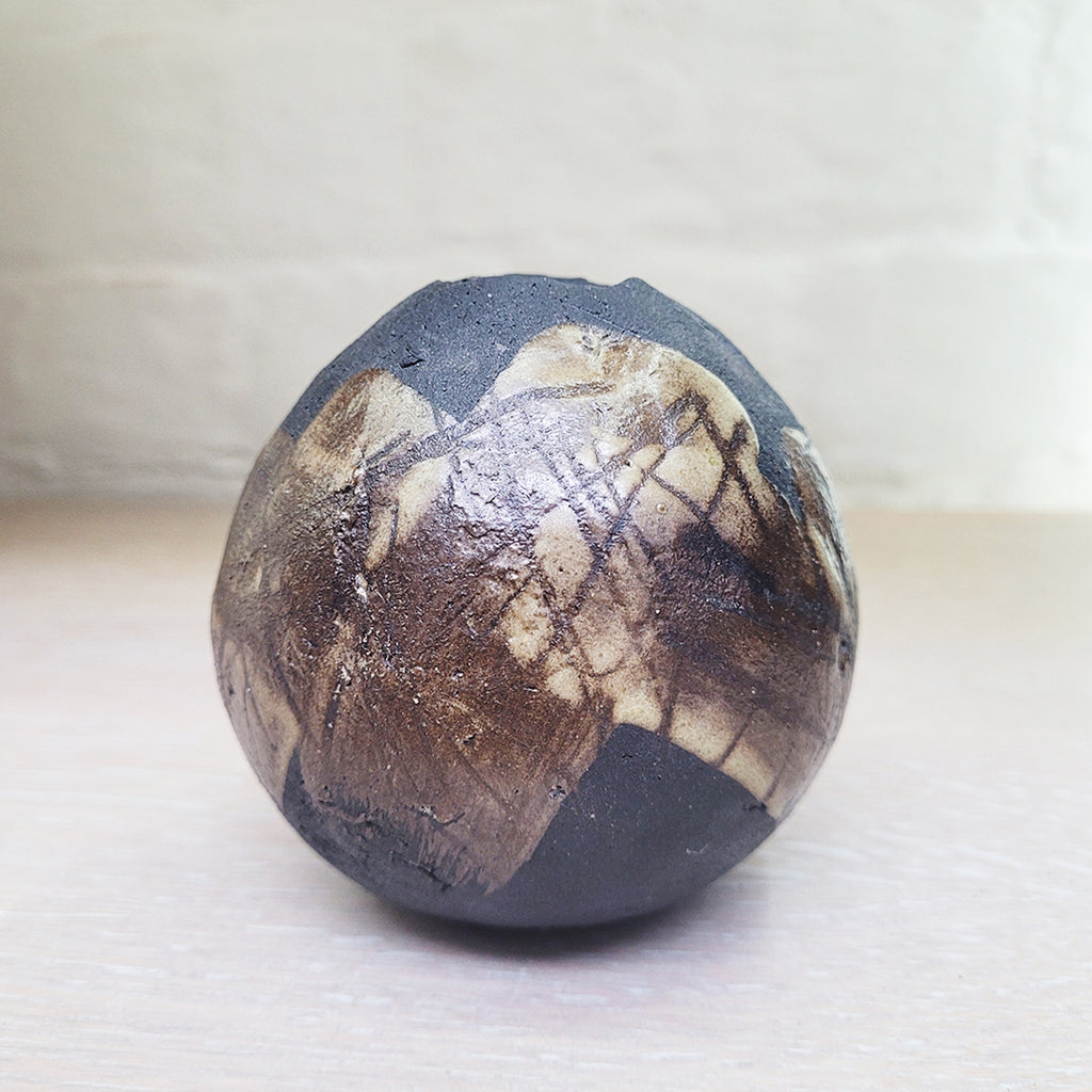 A contemporary ceramic vessel made from clay by ceramic artist Sarah Kirk
This piece is named after the place that has inspired the artist  this shows the reverse side