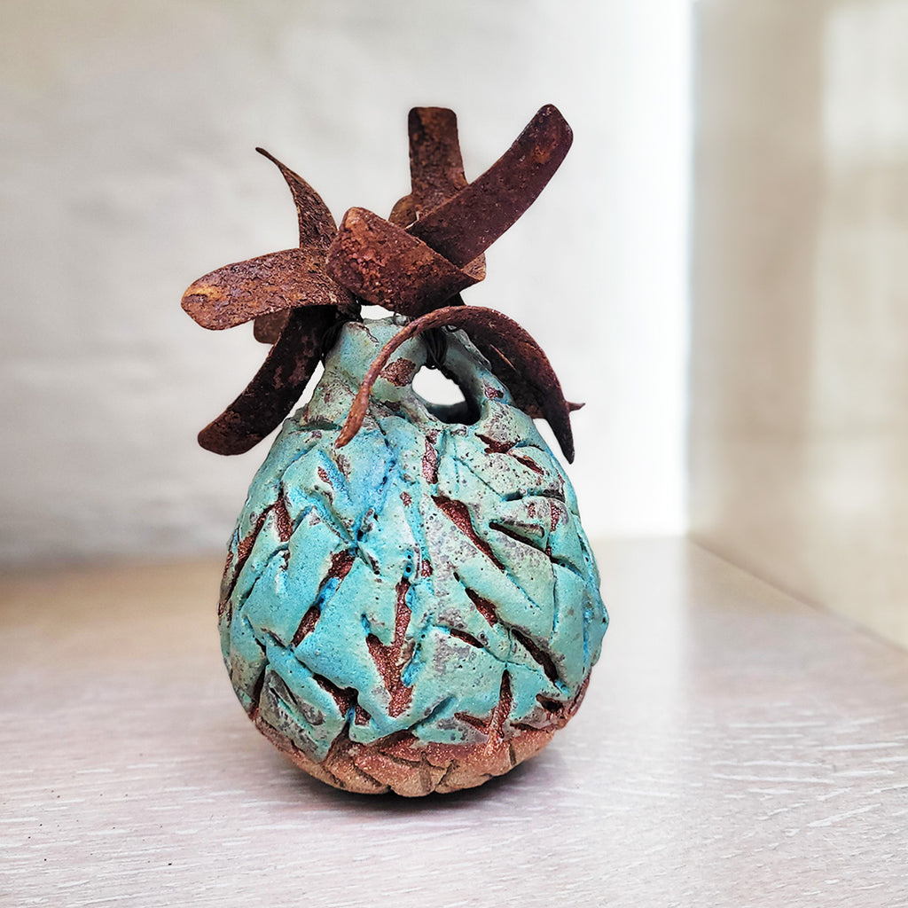 A contemporary ceramic vessel made from oxidised copper & clay by Sarah Kirk