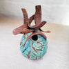 A contemporary ceramic vessel made from oxidised copper & clay by Sarah Kirk viewed from above
