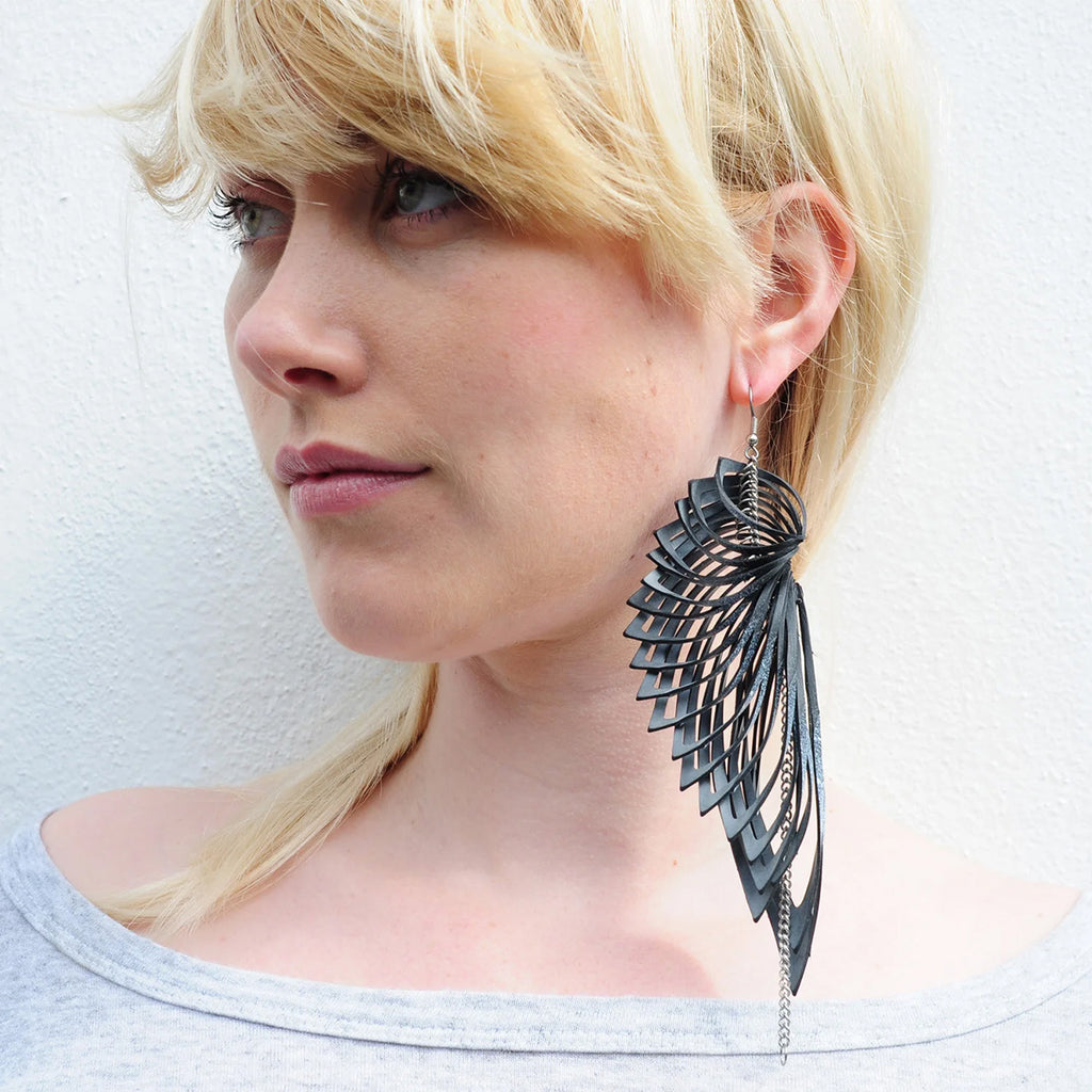 model wearing sculptural rubber earring by Emma Ware