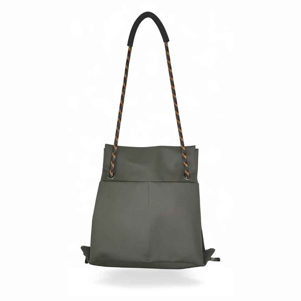 Olive grey backpack bag shown hanging with colorful strap made from faux leather by Studio Ditto