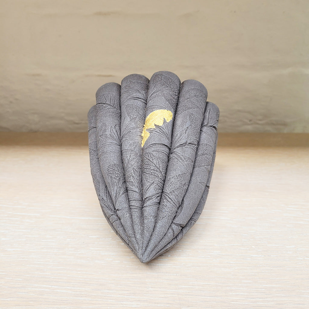 contemporary ceramic dark leaf pod by Ellul Ceramics featuring 24ct gold leaf