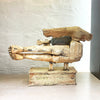 rear of sculpture of a flying figure playing a guitar inscribed with “I’m Going Where the Wind Takes Me” slab-built by contemporary ceramicist Christy Keeney