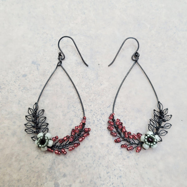 oxidised silver bridal earrings featuring teardrop shape with foliage featuring red and white glass beads