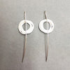 Reverse of earrings inspired by birds nests and natural structures, these earrings on long silver wires, feature individual textured silver and gold circles assembled into a wrapped nest