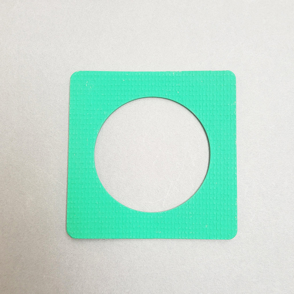 Green square bangle inspired by the Bauhaus design movement. Made from linoleum and hand painted green