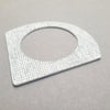 Angled photo of White and grey A-shaped bangle inspired by the Bauhaus design movement. Made from linoleum and hand painted by Studio Ditto in Liverpool