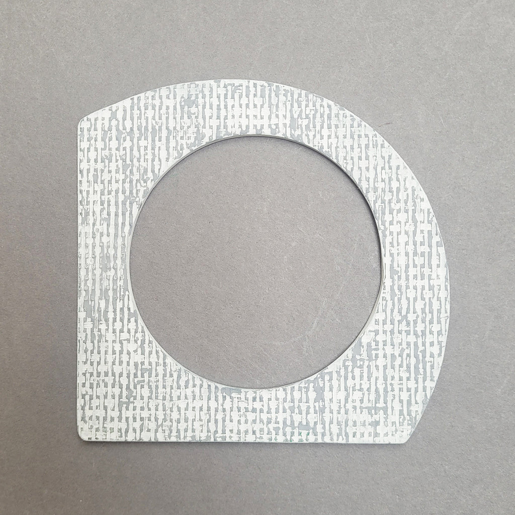 White and grey A-shaped bangle inspired by the Bauhaus design movement. Made from linoleum and hand painted by Studio Ditto in Liverpool