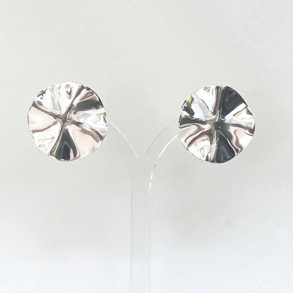 A beautiful pair of hammered round earrings crafted from sterling silver by Irish Silversmith Kevin O’Dwyer.