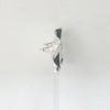 Side view of A beautiful pair of hammered round earrings crafted from sterling silver by Irish Silversmith Kevin O’Dwyer.