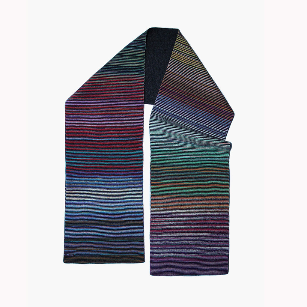 Multicolored striped scarf by Millicent Sanders on a white background