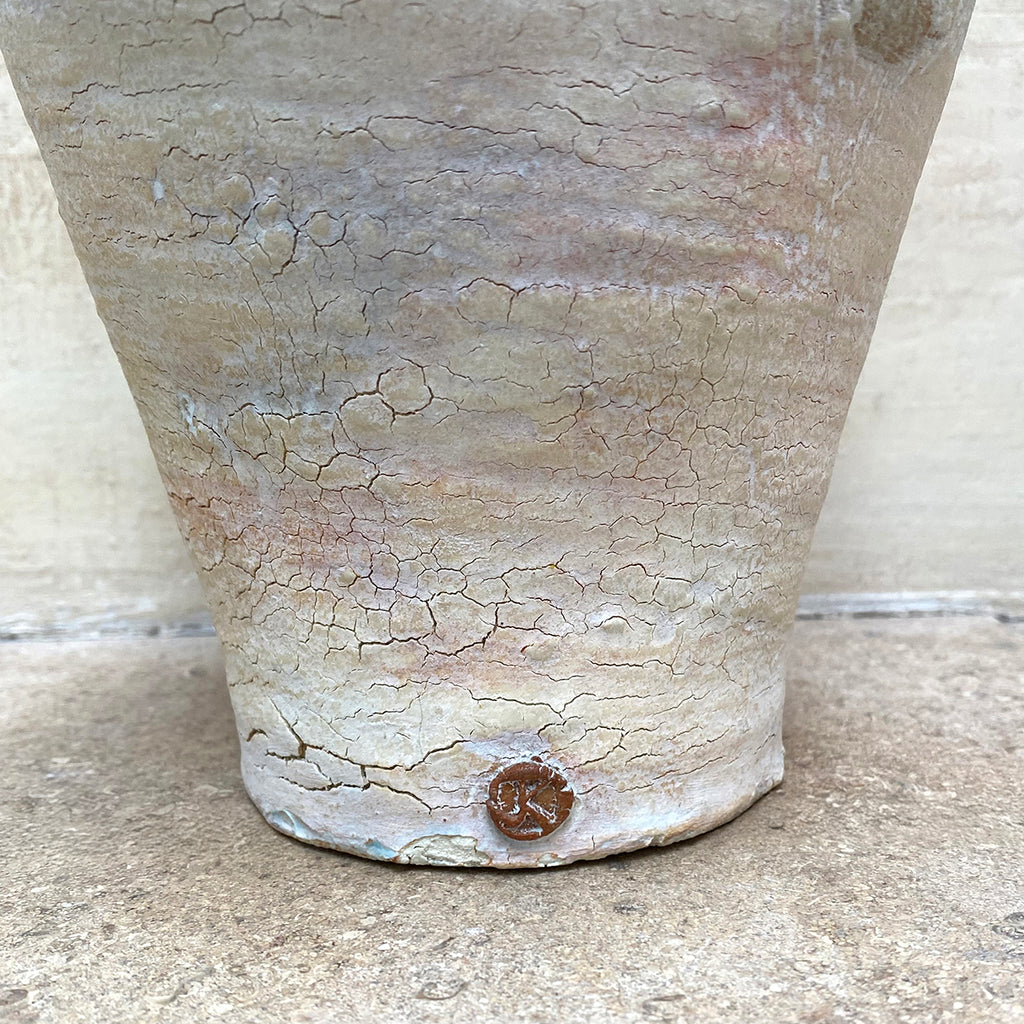 Detail of makers mark on pale ballclay stoneware vase with a crackled texture and two small handles at the sides by contemporary ceramicist John Kershaw