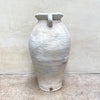 side view of pale ballclay stoneware vase with a crackled texture and two small handles at the sides by contemporary ceramicist John Kershaw at Bluecoat Display Centre