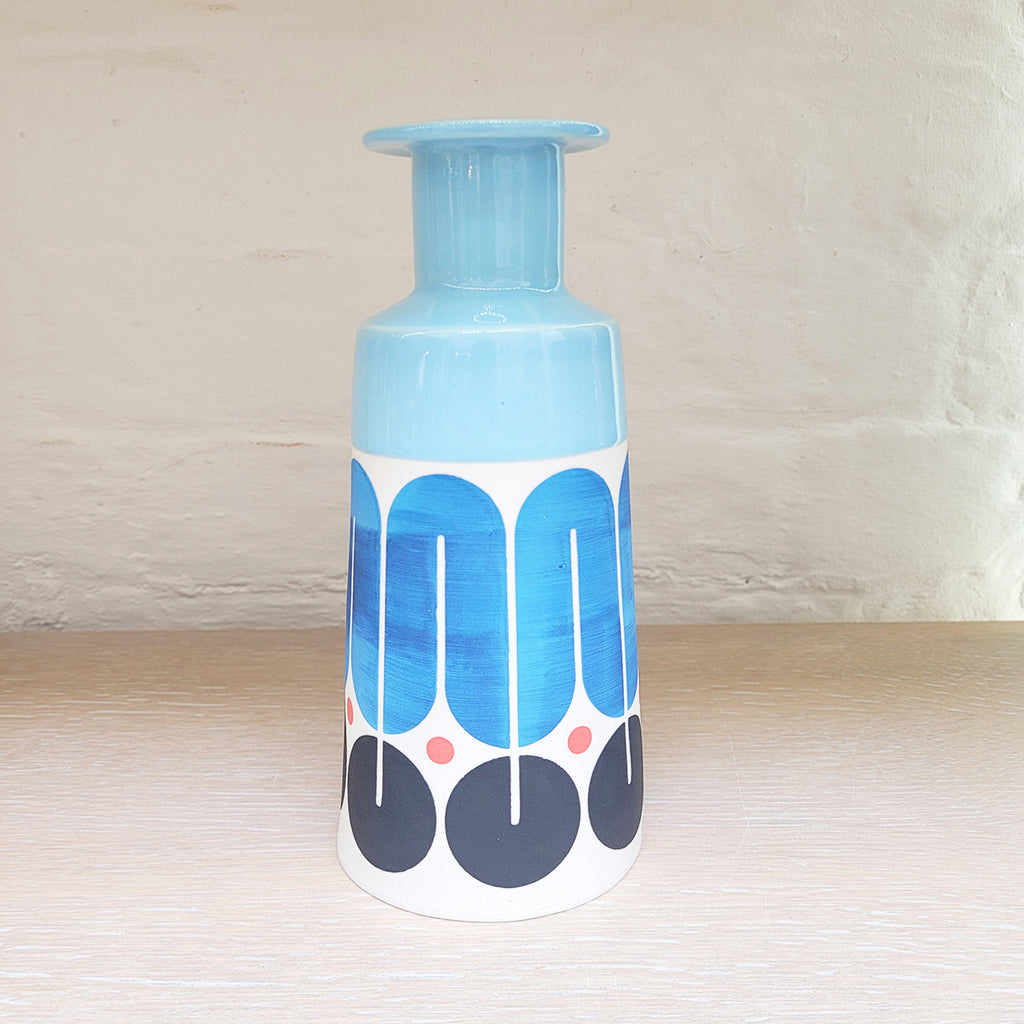 Large contemporary ceramic cone bottle by MAP MAP this piece is predominently white background with shades of blue and black in the pattern