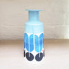 Rear view of Large contemporary ceramic cone bottle by MAP MAP this piece is predominently white background with shades of blue and black in the pattern
