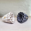 A pair of Leaf Pods with Single 24ct Gold Leaf Detail - 2 contemporary ceramic pieces in opposing finishes by Lisa Ellul from Bluecoat Display Centre