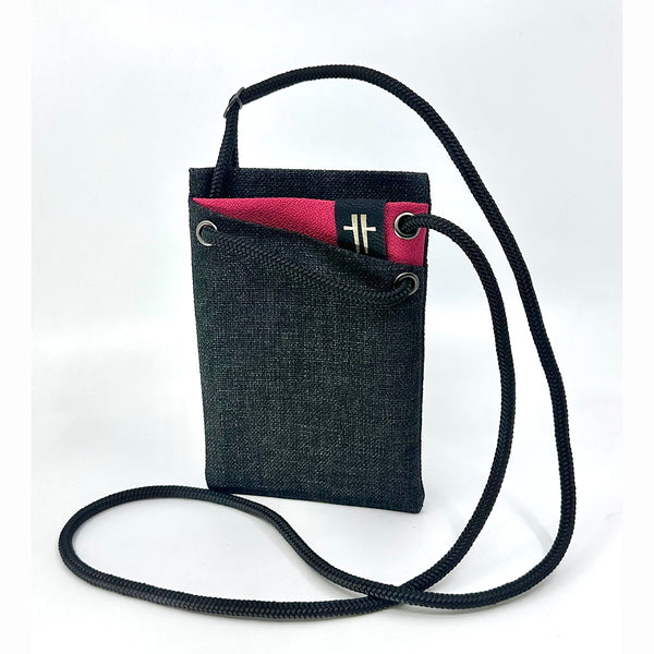 Mini 'portable pocket' bag crafted from reclaimed upholstery textiles and blinds in dark grey with a fuchsia accent