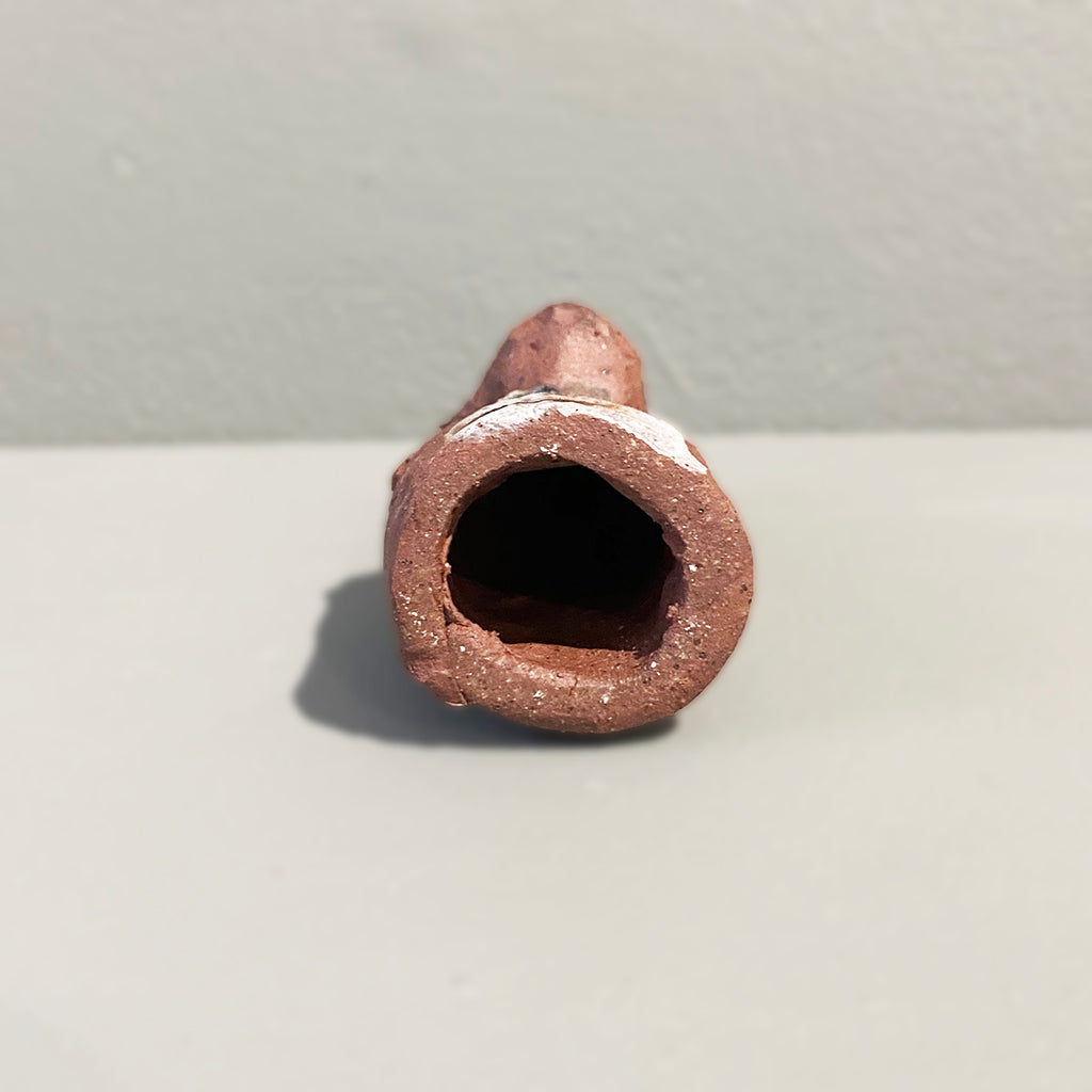 base of Miniature Ceramic Faun figure with large 'listening ears' loosely inspired by creation stories, from folklore by contemporary ceramicist Sharon Griffin