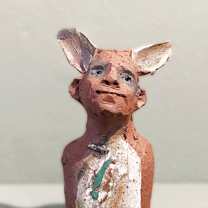 Close Up of Miniature Ceramic Faun figure with large 'listening ears' loosely inspired by creation stories, from folklore by contemporary ceramicist Sharon Griffin