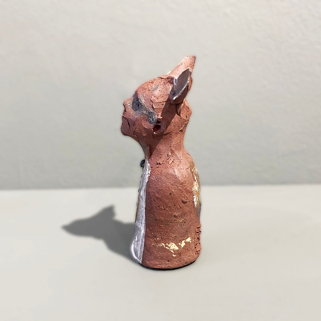 Left Side View of Miniature Ceramic Faun figure with large 'listening ears' loosely inspired by creation stories, from folklore by contemporary ceramicist Sharon Griffin