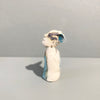 Left side view of Miniature figure with large 'listening ears' loosely inspired by creation stories, from folklore by contemporary ceramicist Sharon Griffin