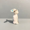 Right Side View of Miniature figure with large 'listening ears' loosely inspired by creation stories, from folklore by contemporary ceramicist Sharon Griffin